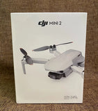 DJI Mini 2 drone box showing quadcopter with built-in camera