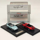 Diecast cabriolet toy cars: light blue and red on display bases