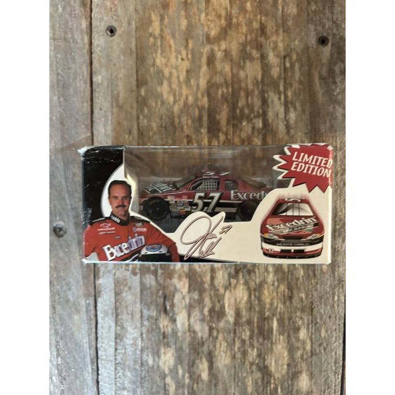 Limited edition diecast racing car in packaging with red and white car and driver
