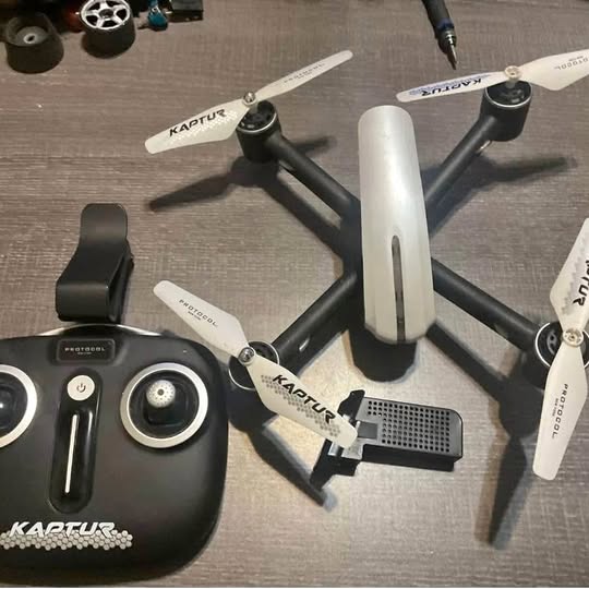 White GPS Wi-Fi drone with remote controller and battery pack