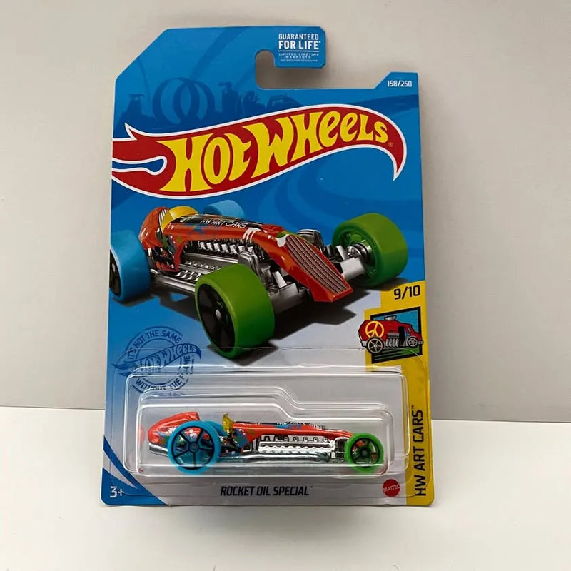 Hot Wheels diecast race car with orange, teal, and green details, in blister package