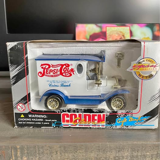 Pepsi diecast metal bank truck with blue body and Pepsi logo, coin bank in retail box