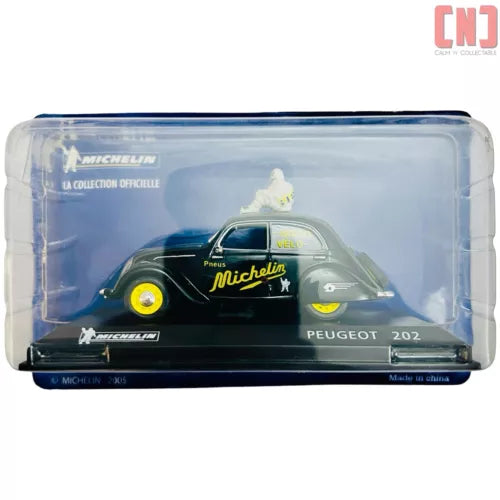 Diecast Peugeot 202 van model in clear display box with blue base