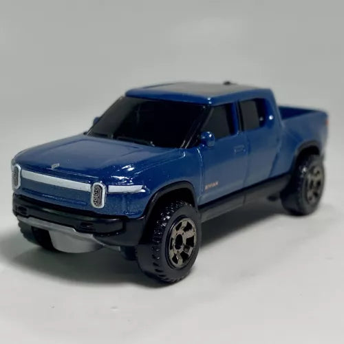 Blue diecast EV pickup truck model, 1:64 scale, front three-quarter view