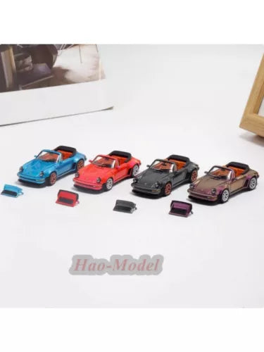 Alloy diecast car model collection with four cars in blue, red, black, and pink, plus parts