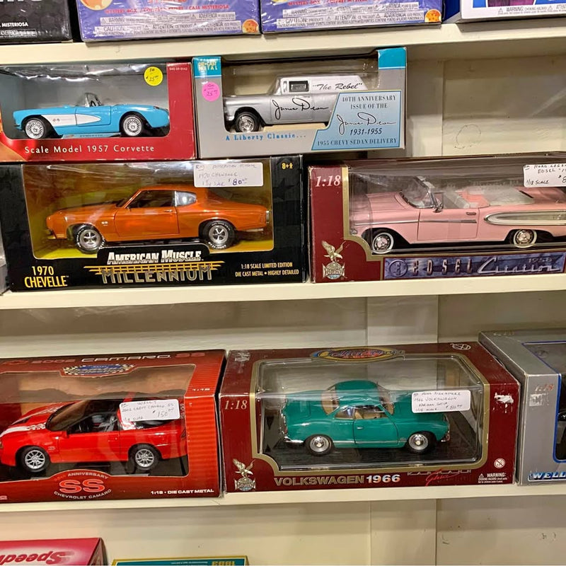 Teal 1:18 diecast model car in clear display box