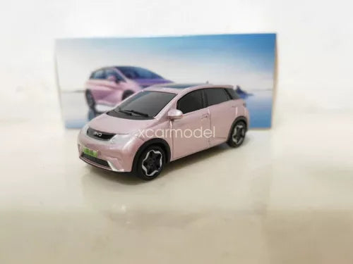 Pink 1/64 diecast car model toy with black wheels, angled side view