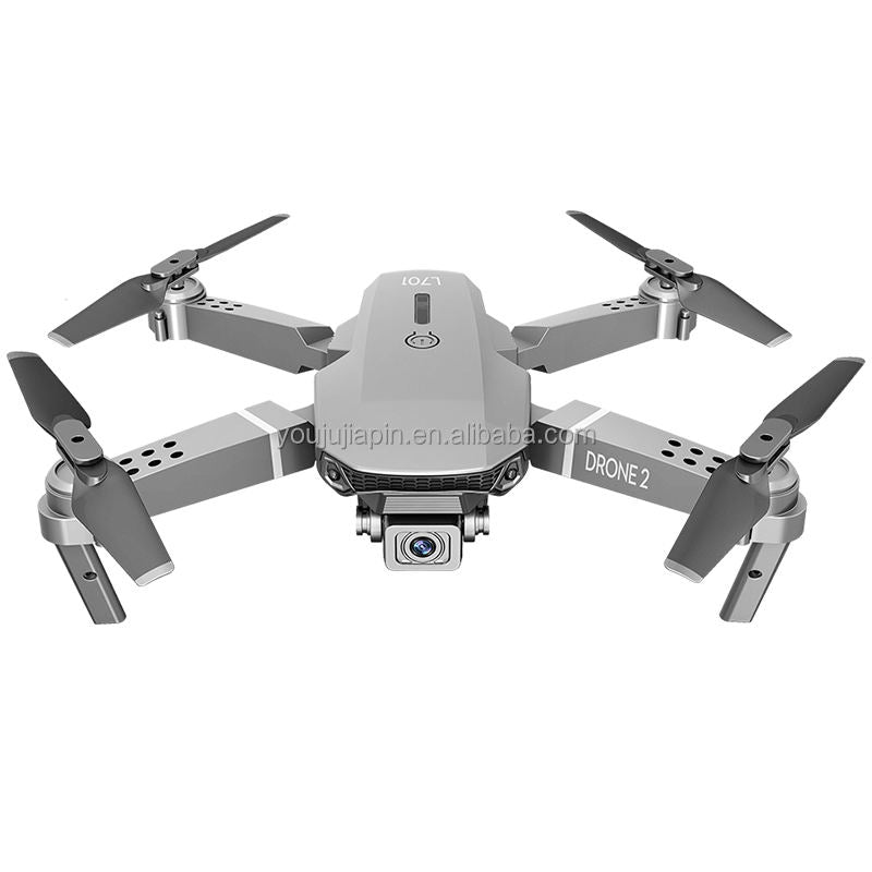 Gray foldable mini quadcopter drone with 4K camera and four propellers