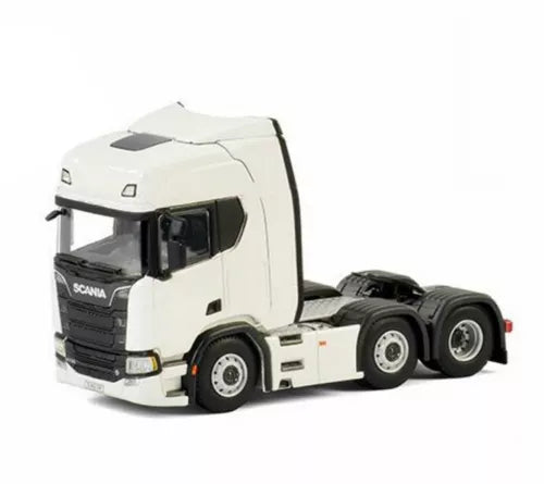 White 1/50 diecast Scania tractor truck model with black wheels, front-left view