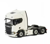 White 1/50 diecast Scania tractor truck model with black wheels, front-left view