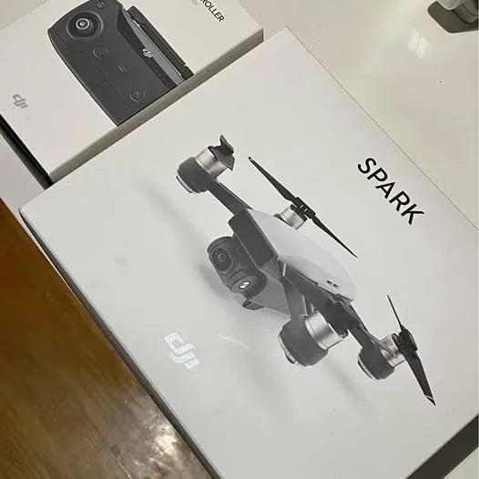 DJI Spark drone on white retail box, front view with four propellers