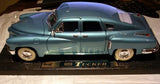 1/18 diecast vintage sedan model car, teal blue, front-left angled view