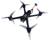 Quadcopter drone with four propellers and visible onboard electronics