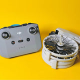 DJI drone controller with built-in joysticks and open propeller guard