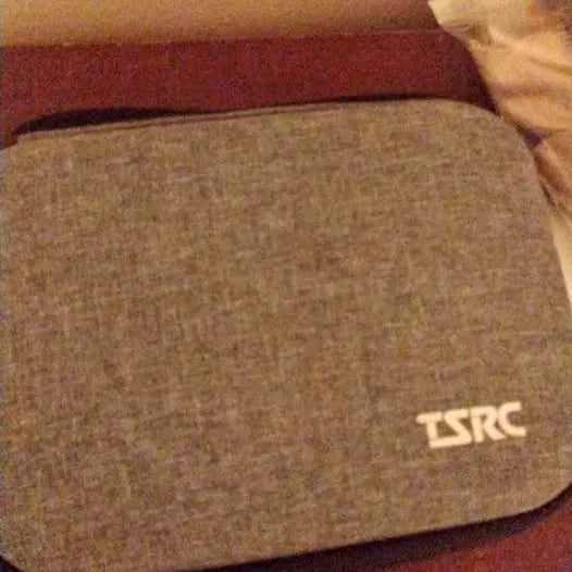 Gray fabric drone storage bag with TSRC logo on side