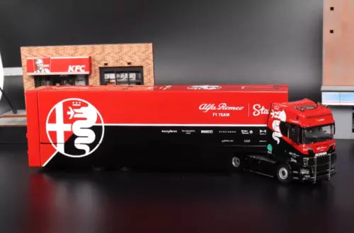 Red and black enclosed double-deck truck model diecast, with cab and trailer details