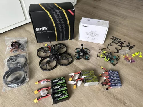 FPV drone bundle with quadcopter frames, propellers, batteries and spare parts