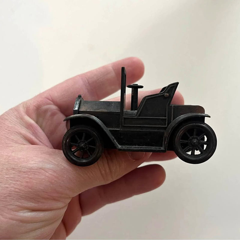 Diecast Model T car pencil sharpener, black toy car shape with upright lever.