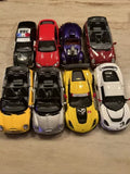 1:36 diecast car lot of 8 toy vehicles, assorted colors including red, purple, black, yellow, white