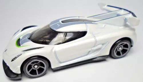 White die-cast toy car with black details and gray windows, 1:64 scale
