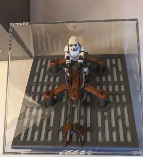 Collector speeder bike drone with pilot helmet figure, brown and black