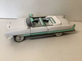 Diecast convertible car model with green stripe, open door, light body