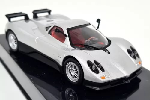 Silver diecast supercar model car with black front splitter and headlights, front three-quarter view