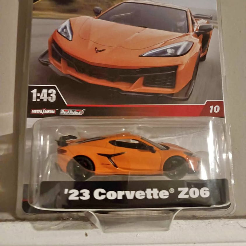 Orange 1:43 diecast '23 Corvette Z06 model in retail blister package