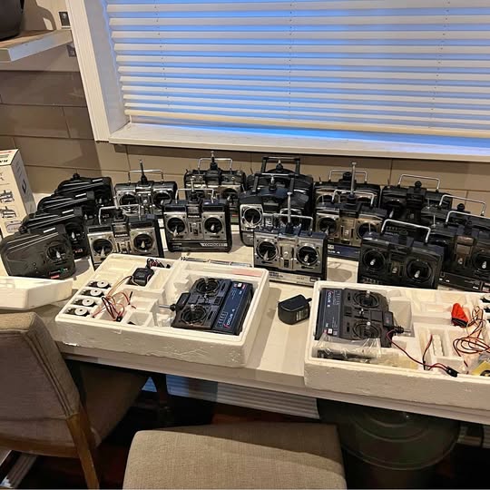 Vintage RC airplane and helicopter transmitter lot with multiple controllers and screens