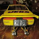 Yellow 1/24 scale pro stock diecast car model with rear wing and open wheels