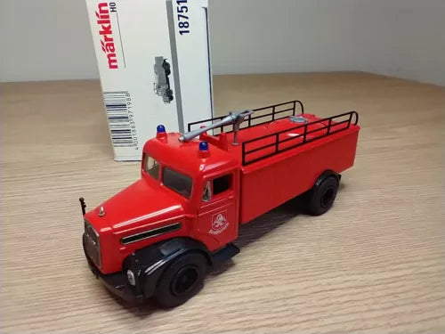 Red HO gauge fire engine diecast model truck with front cab and raised ladder rack