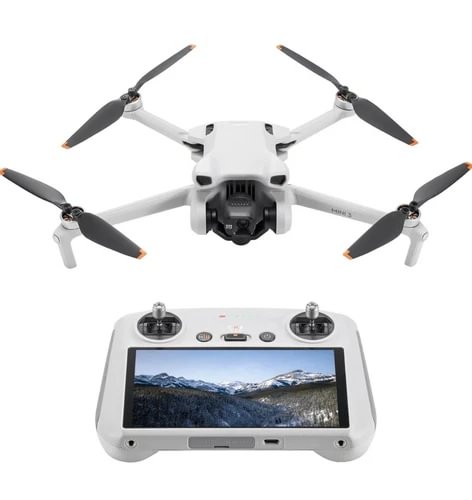 White foldable quadcopter drone with camera and four rotors, with remote controller screen
