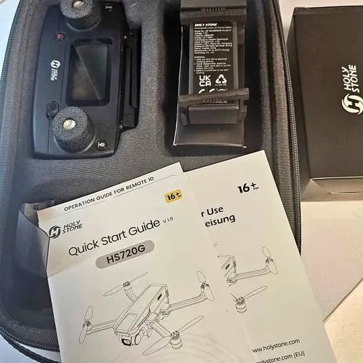 Drone accessory set with controller, battery pack, and quick start guide