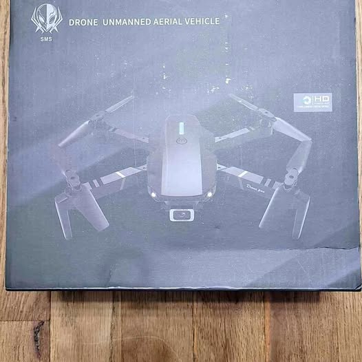 Quadcopter drone with four propellers and a central camera module