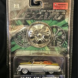 Collectible diecast metal convertible car in blister pack, silver with detailed wheels