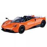 Orange 1:24 diecast roadster model car with black wheels and open cockpit