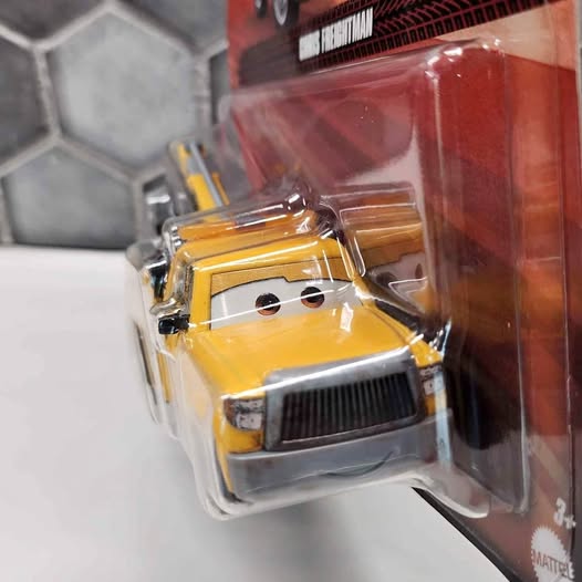 Yellow tow truck diecast with front grille, chrome details and Mattel branding