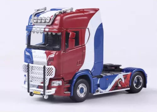 Red and blue diecast tractor unit truck model with front chrome grille