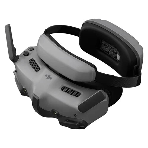 DJI goggles headset with gray shell, black strap, and side antenna