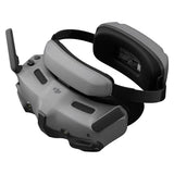 DJI goggles headset with gray shell, black strap, and side antenna