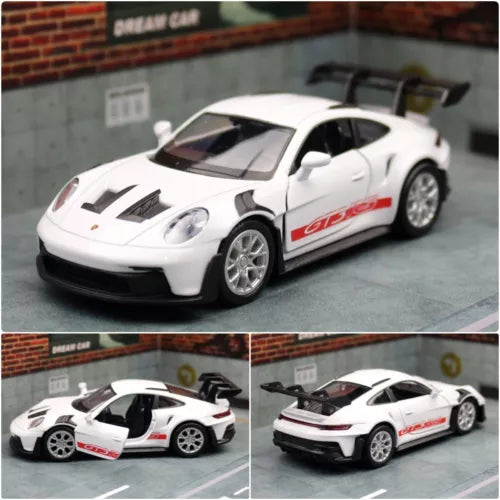 White Porsche 911 GT3 diecast race car model toy with red decals, door open