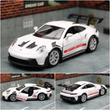 White Porsche 911 GT3 diecast race car model toy with red decals, door open