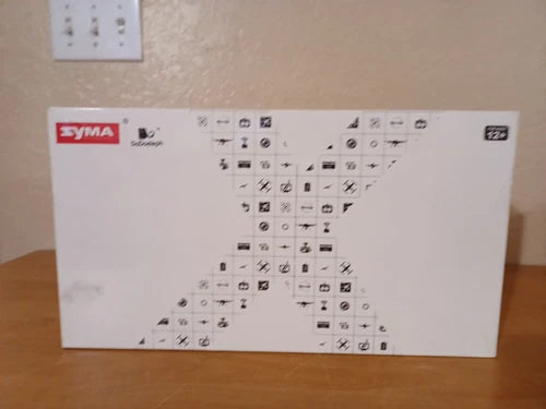 SYMA quadcopter drone packaging box with icons
