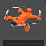Orange quadcopter drone with four propellers and central camera mount.