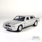 1/36 scale silver Jaguar XJ6 diecast model car, front 3/4 view