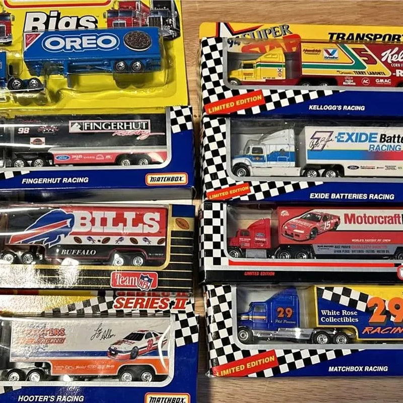 Diecast semi hauler toy truck in box with race branding and checkered stripes