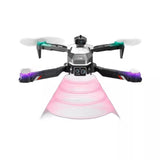 Quadcopter drone with front camera and pink protective dome, blue prop LEDs.