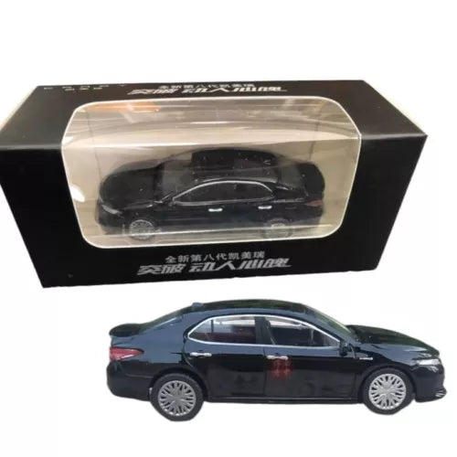 Black diecast sedan model car with clear display box, side view.