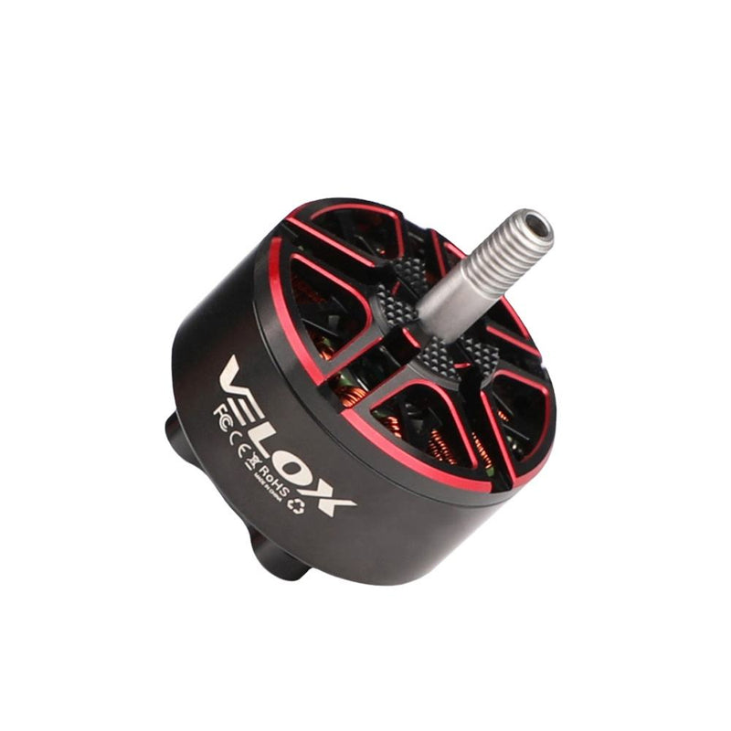 Brushless quadcopter drone motor with red stator fins and silver shaft