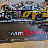 Diecast NASCAR race car model with #17 Team Caliber livery, blue and yellow wheels.